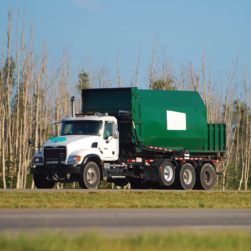 Roll-off dumpster truck for debris removal services