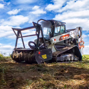 Bobcat forestry mulcher clearing overgrown land